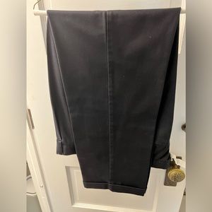 IZOD navy men’s pleated and cuffed pants.